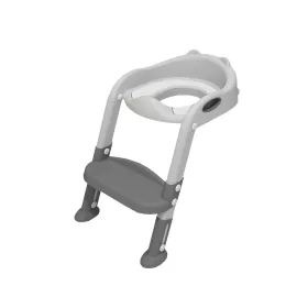 Toaleta ze zwężającymi się schodami w kolorze szarym